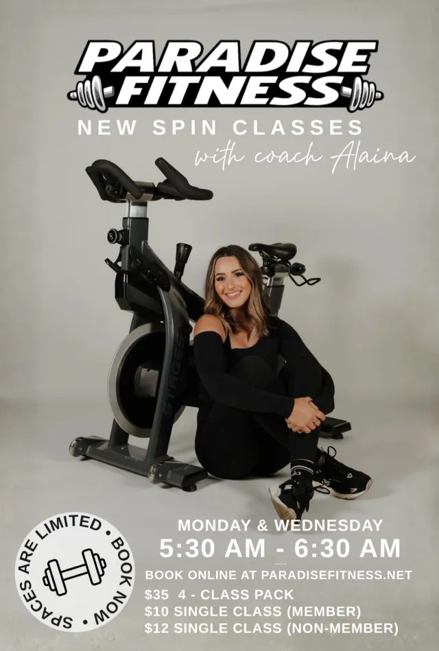 Coach Alaina with a spin bike