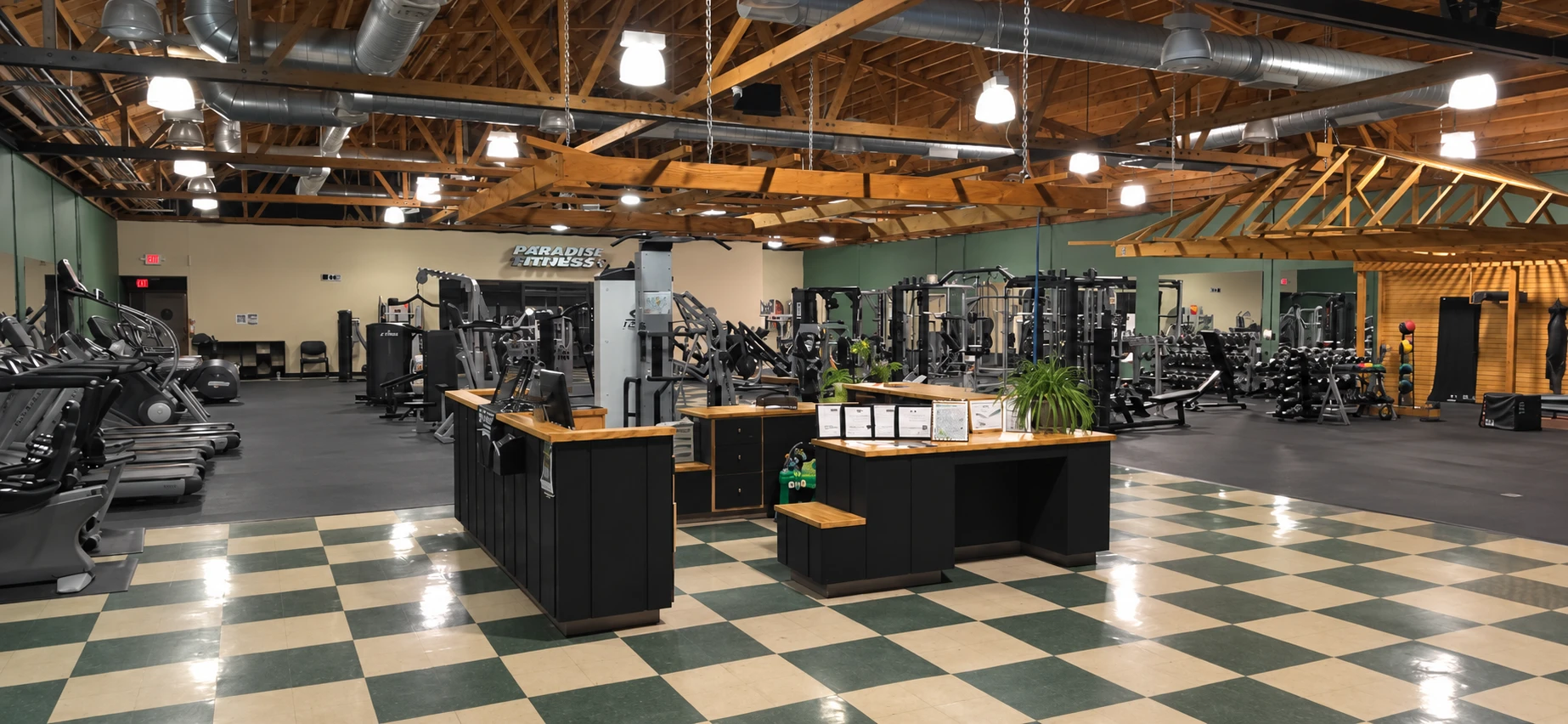 Reception desk and open gym floor at Paradise Fitness